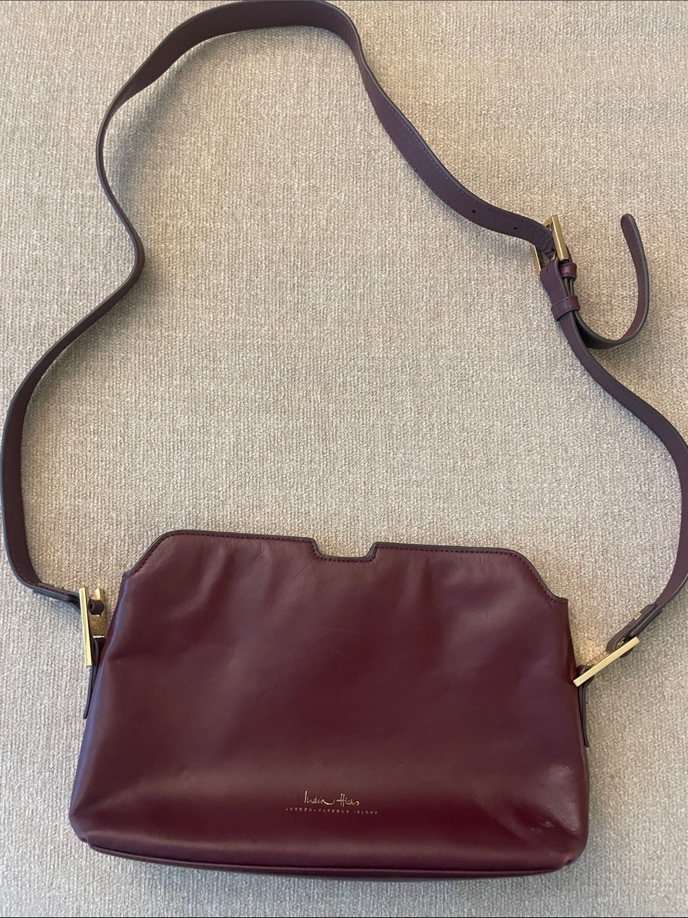 India Hicks plum leather crossbody bag with gold hardware